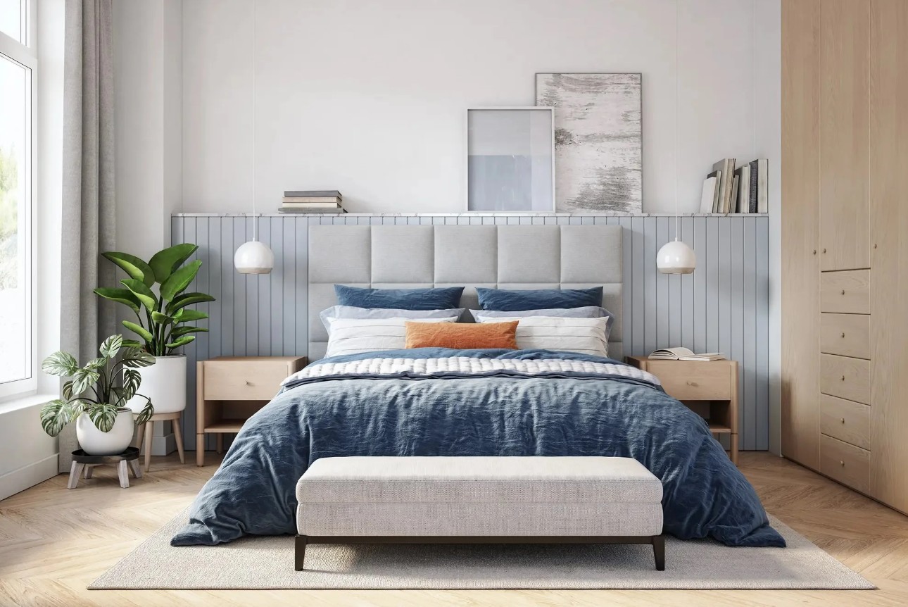 A freshly cleaned, neatly made bedroom with natural light